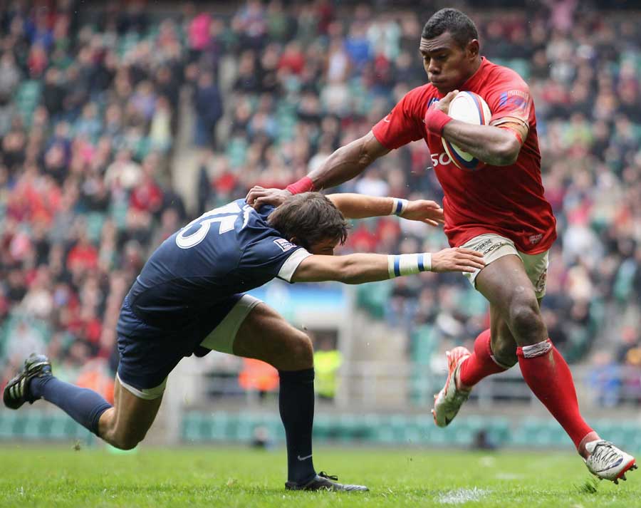 The Army's Semesa Rokoduguni hands off a tackle en route to the try line