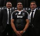 The New Zealand Maori All Blacks coaches stand alongside skipper Tanerau Latimer