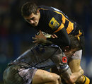 Wasps Jonah Holmes is tackled by Cardiff's Gavin Evans 
