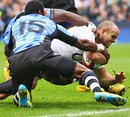 England's Charlie Sharples forces his way over for a try