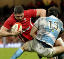 Wales' Rob McCusker is stopped by Gonzalo Tiesi