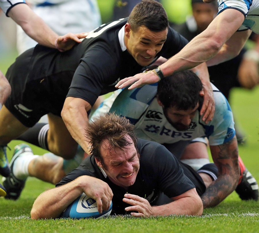 New Zealand's Andrew Hore burrows over for a try
