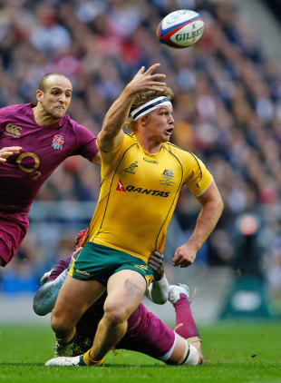 Australia's Michael Hooper off loads the ball in the tackle, England v Australia, Twickenham, England, November 17, 2012