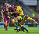 England's Thomas Waldrom is tackled by Australia's Kurtley Beale