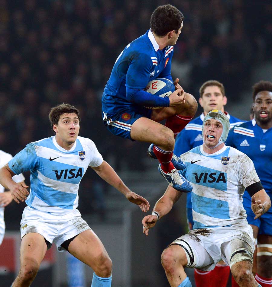 France's Brice Dulin catches the ball under pressure from the Pumas