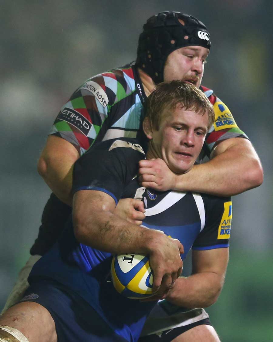 Bath's Simon Taylor is wrapped up by Mark Lambert