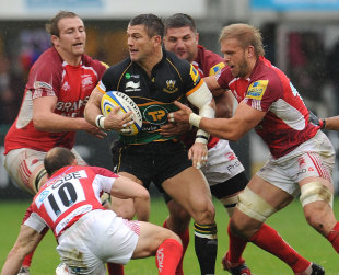 Tom May is surrounded by London Welsh defenders