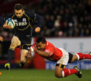 Scotland's Greig Laidlaw tries to outstrip the Tongan cover