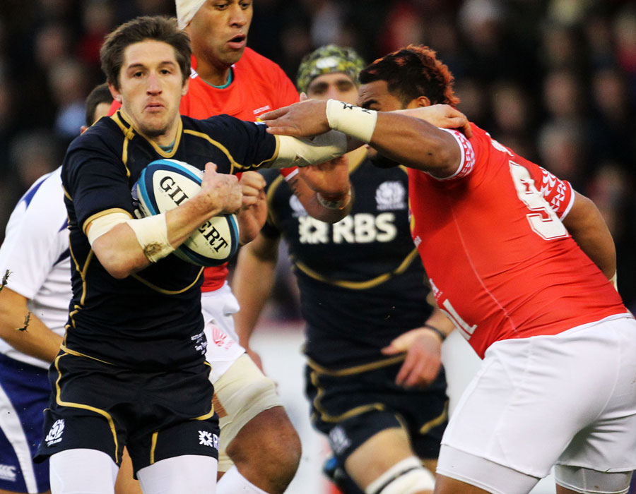 Scotland's Henry Pygros ducks inside a would-be tackler