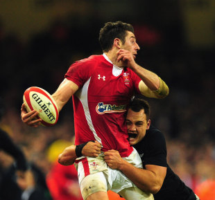 Wales wing Alex Cuthbert looks for support as New Zealand fullback Israel Dagg makes a tackle. Wales v New Zealand, Millennium Stadium, Cardiff, Wales, November 24, 2012
