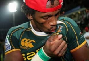 South Africa's Mzwandile Stick of kisses the Springbok emblem after as South Africa beat England in the Final of the 2008 Emirates Airline Dubai Sevens at The Sevens in Dubai, UAE on November 29, 2008.