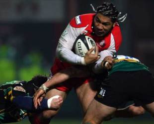 Gloucester's Lesley Vainikolo breaks through a tackle during their Premiership game against Northampton Saints at Kingsholm in Gloucester on November 29, 2008.