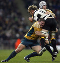Schalk Burger feels the crunch as Matt Dunning goes in for the tackle