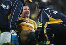Matt Dunning winces in agony after snapping his Achilles tendon