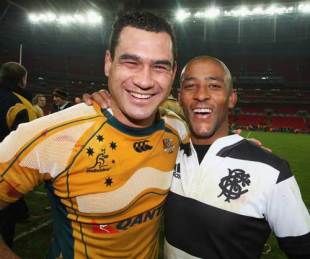 Former Australia team-mates George Smith and George Gregan share a laugh after Smith's Wallabies defeated the Barbarians, December 3 2008
