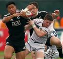 New Zealand's Belgium Tuatagaloa vies with Russia's Denis Simplikevich 