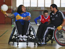 New Zealand's Ma'a Nonu and Piri Weepu take part in a Wheelchair Rugby game
