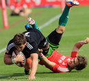 New Zealand's Scott Curry is tackled by Portugal's Nuno Guedes