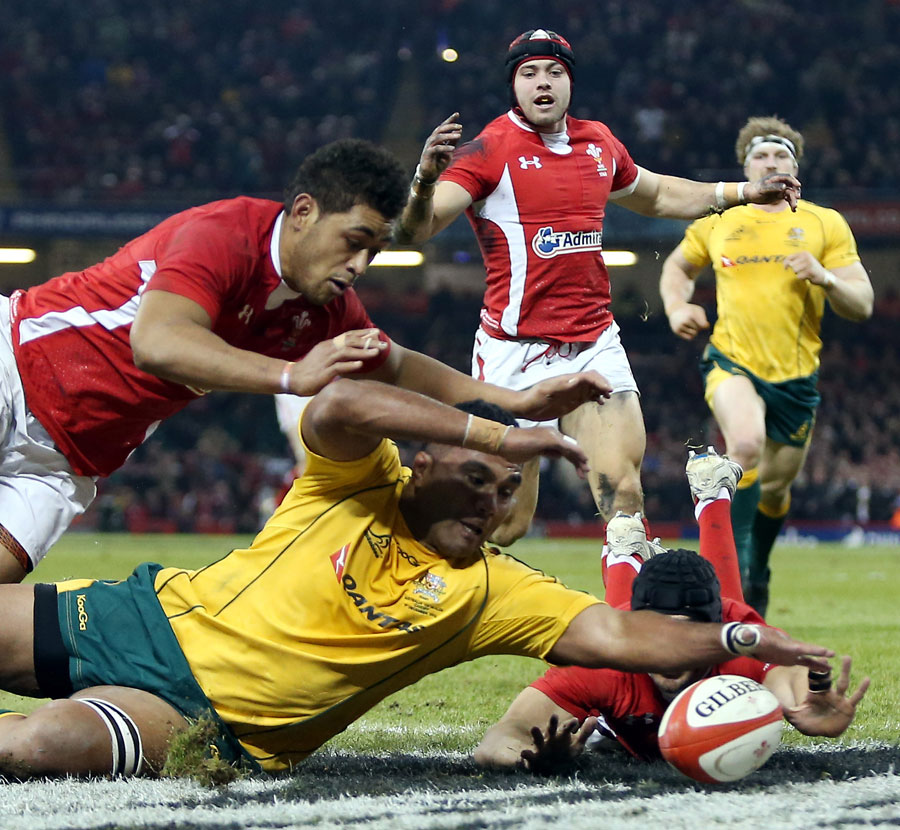 Australia's Wycliff Palu dives for the loose ball