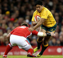 Australia's Ben Tapuai tries to beat a Wales defender