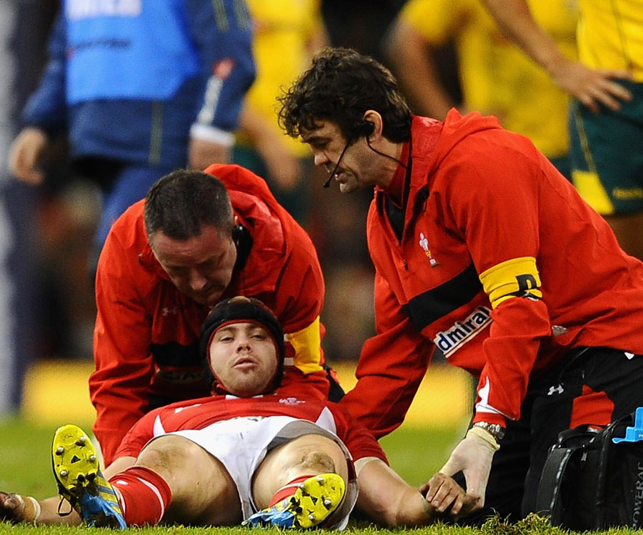 Wales' Leigh Halfpenny receives treatment