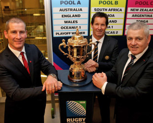 England coach Stuart Lancaster, Australia coach Robbie Deans and Wales coach Warren Gatland pose with the Rugby World Cup, 2015 Rugby World Cup pool allocation draw, Tate Modern, London, England, December 3, 2012