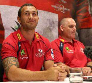 Quade Cooper sits alongside Ewen McKenzie on the day he signed a new contract, Brisbane, Australia, December 7, 2012