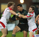 George Pisi gets wrapped up by the Ulster defence