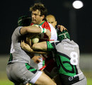 Biarritz's Charles Gimenez is wrapped up by Connacht's defence