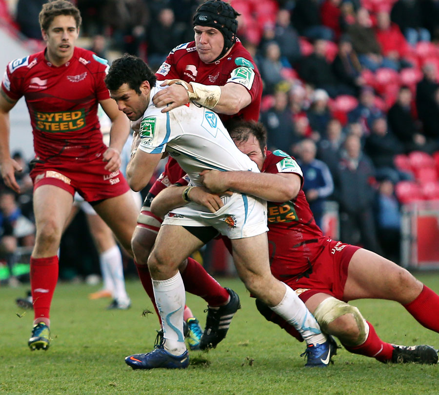 Exeter's Kevin Barrett stretches the Scarlets' defence
