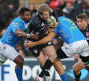 Leicester's Mat Tait is wrapped up by two Treviso defenders