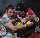 Gloucester's Tom Savage is wrapped up in a tackle