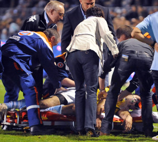 Bayonne's Francois Carillo is attended to by medical staff following a suspected heart attack, Bayonne v Mont-de-Marsan, Stade Jean Dauger, Bayonne, France, December 22, 2012