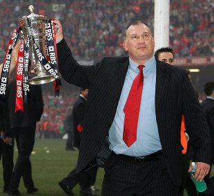 Wales head coach Mike Ruddock shows off the Six Nations trophy after his team had secured a grand slam. Wales v France, Six Nations, Millennium Stadium, Cardiff, Wales, March 19, 2005