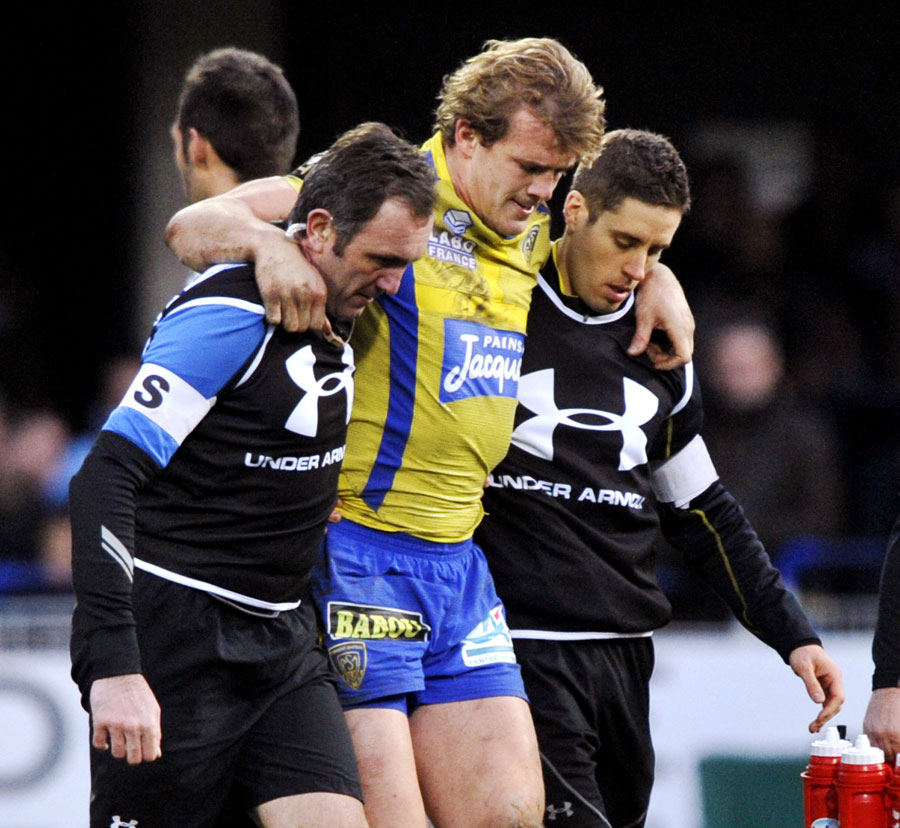 Clermont Auvergne's Aurelien Rougerie is helped off the pitch 