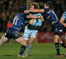 Leicester's Mathew Tait is wrapped up by the Worcester defence