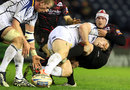 Leinster's Cian Healy tackles Edinburgh's Andy Titterrell 