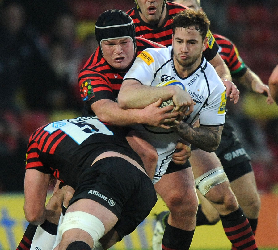Sale's Danny Cipriani is wrapped up by the Saracens defence