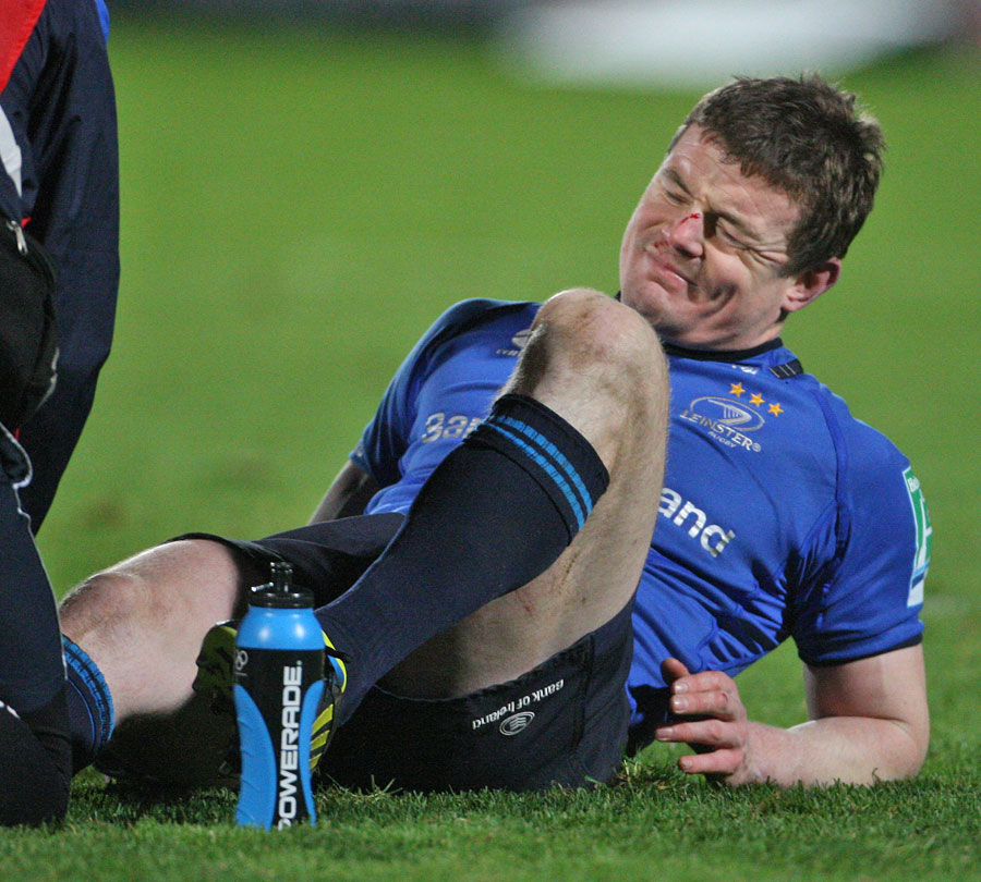 Leinster's Brian O'Driscoll grimaces as he receives treatment