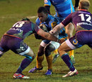 Wasps' Christian Wade is tackled by the Dragons' defence
