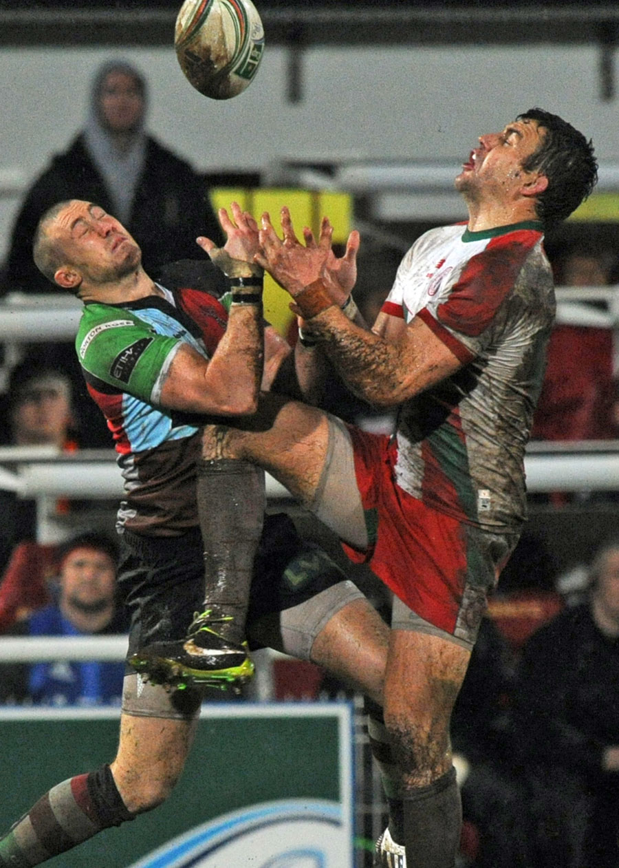 Quins' Mike Brown and Biarritz' Damien Traille vie for a high ball