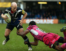 Bath's Peter Stringer looks to evade a tackle