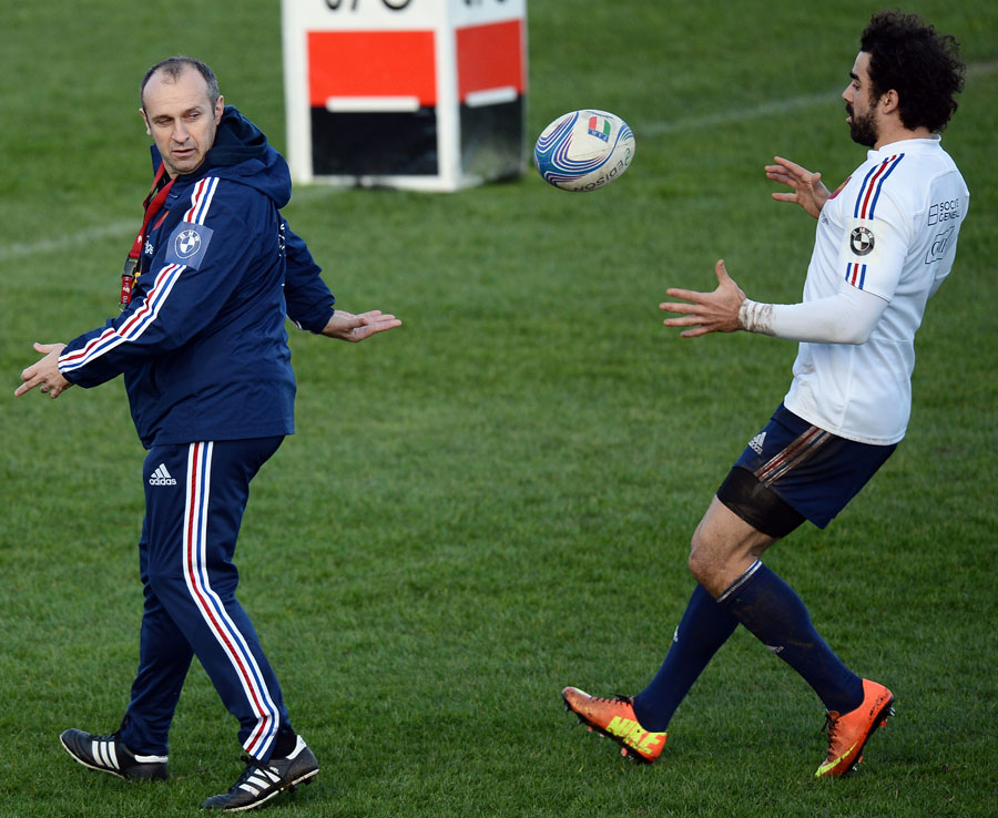 France coach Philippe Saint Andre passes the ball to winger Yoann Huget 