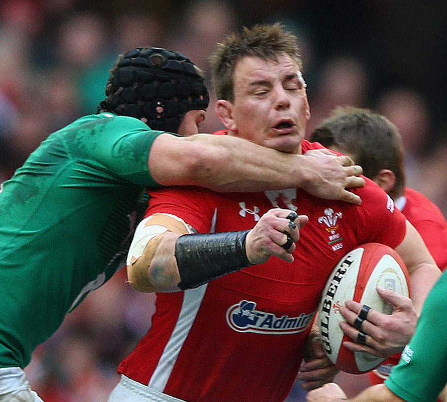 Wales' Matthew Rees feels the full force of Irish tackling
