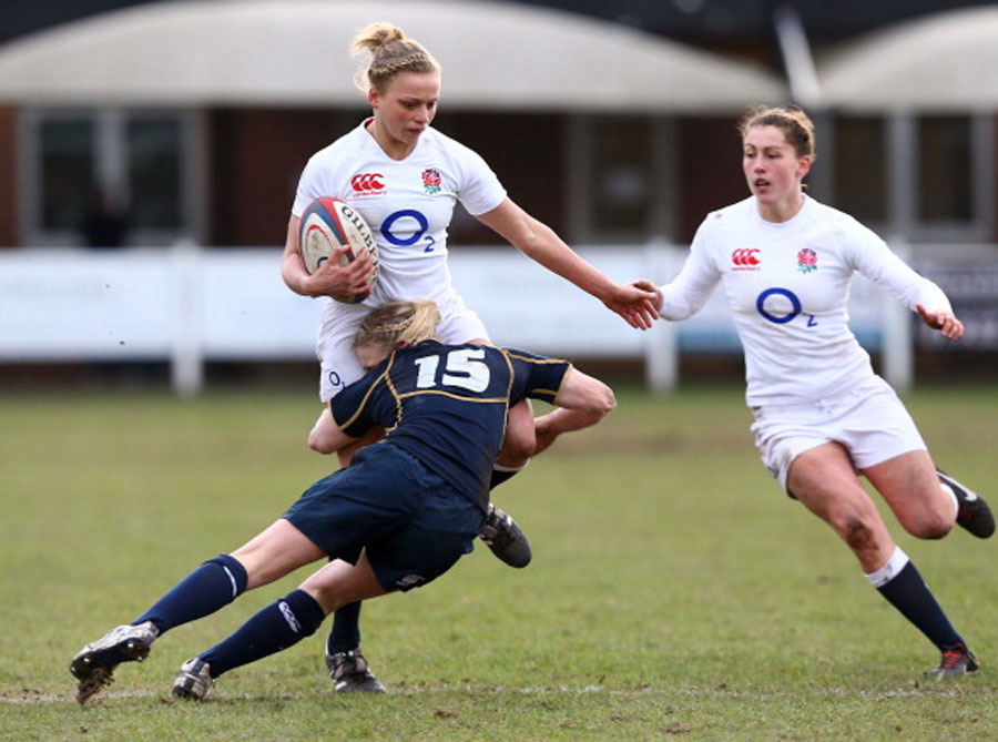 Kay Wilson is tackled by Steph Johnston during England's 76-0 win