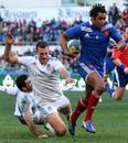 France's Benjamin Fall sprints away from the Italian tacklers