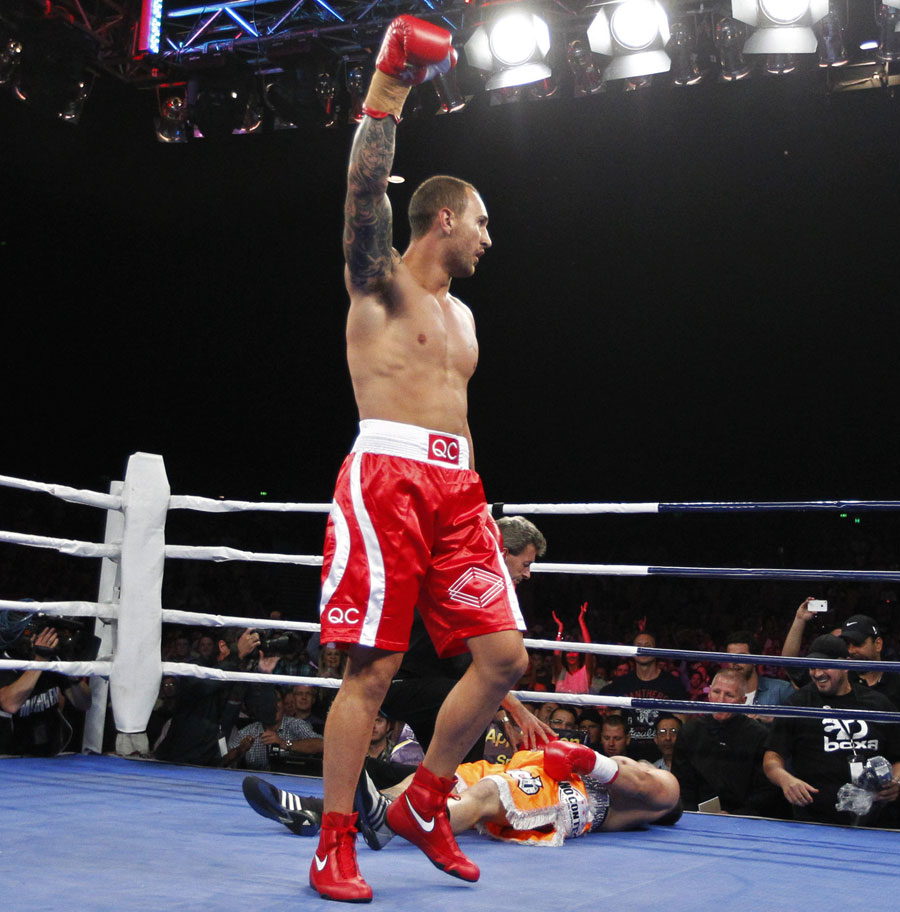 The Reds' Quade Cooper celebrates winning his first boxing bout