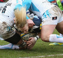 Bath's Tom Biggs tries to squeeze through Worcester's defence