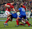 Wales' George North is tackled by the France defence
