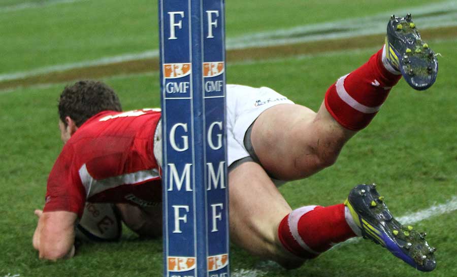 Wales' George North crashes over in the corner